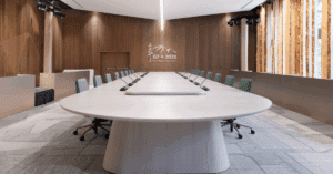 Empty G7 Summit conference room in Kananaskis with round table, microphones, and modern wood-panelled walls