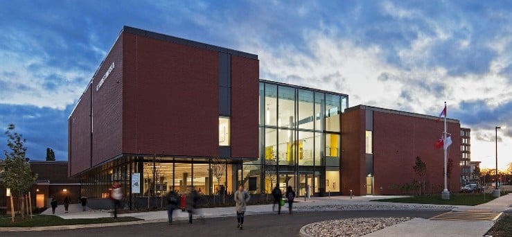 St. Jerome's University Residence building designed by MCW, featuring a modern brick façade, glass entrance, and student housing in Waterloo, Ontario.