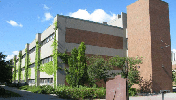 York University Farquharson Life Sciences Building in Toronto, Ontario, featuring a three-storey academic research facility with brick and concrete exterior and landscaped campus setting.